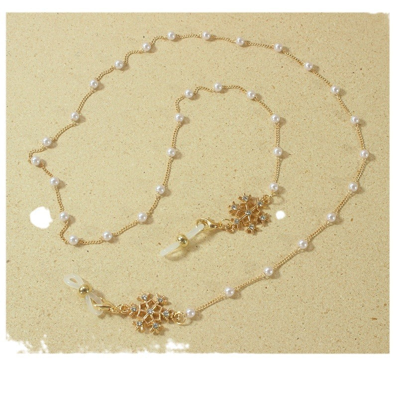 Elegant glasses holder chain with pearls and snowflake pendant Stornfield