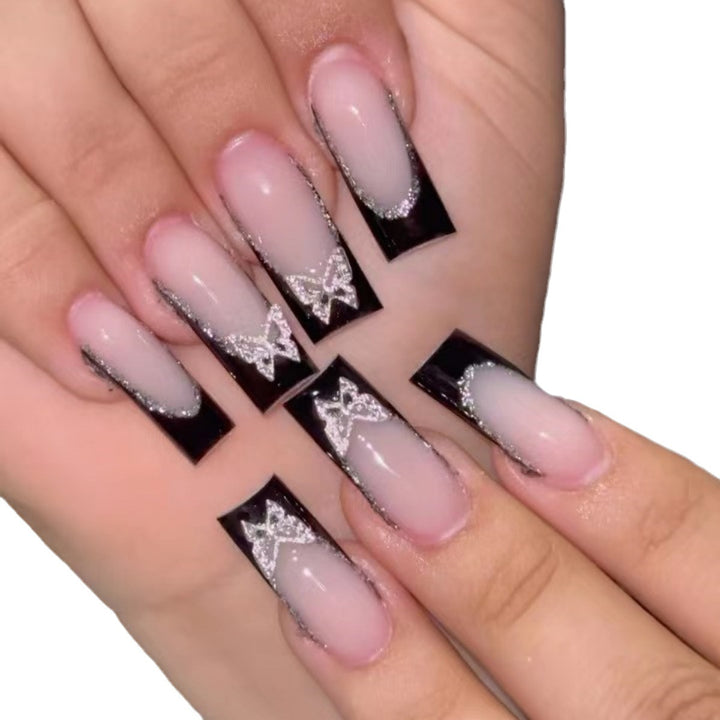 Glamorous Stiletto Nail Extensions with Butterfly Accents Stornfield