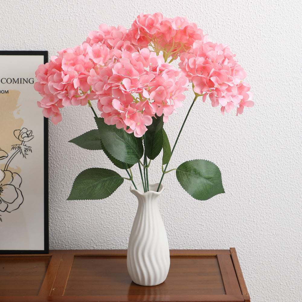 Decorative artificial flower arrangement