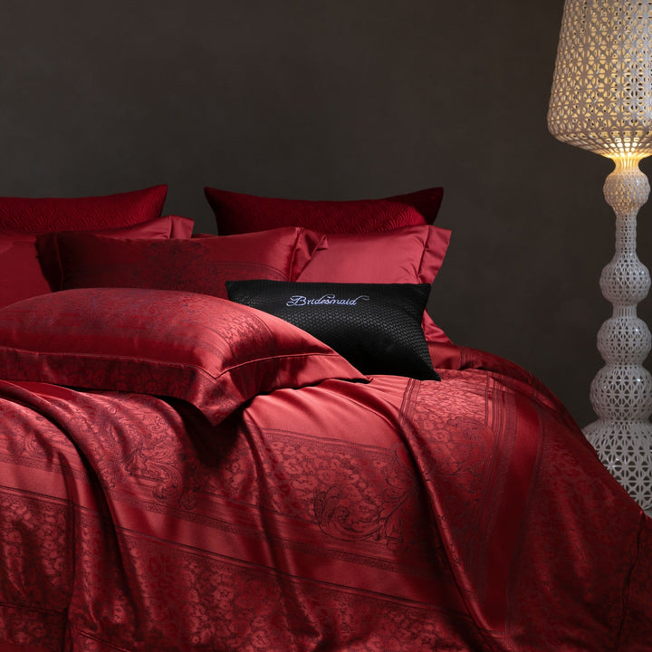 Luxurious satin bedding set with jacquard lace pattern and decorative pillow