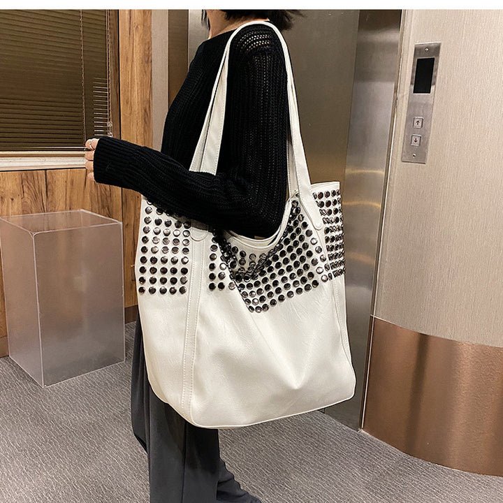 Fashionable shoulder bag with stylish rivet details Stornfield
