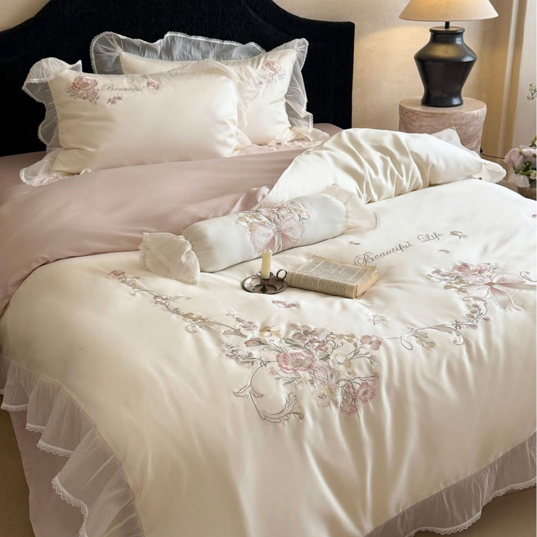 Embroidered satin bedding set with frill, ruffles, and decorative pillow