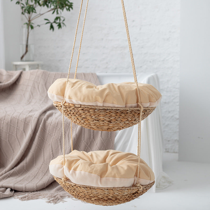 Hanging chair made of braided natural material with comfortable cushions Stornfield