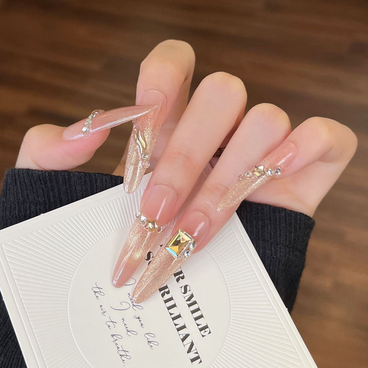 Artistic Stiletto Press-On Nail Art with Glimmering Accents Stornfield