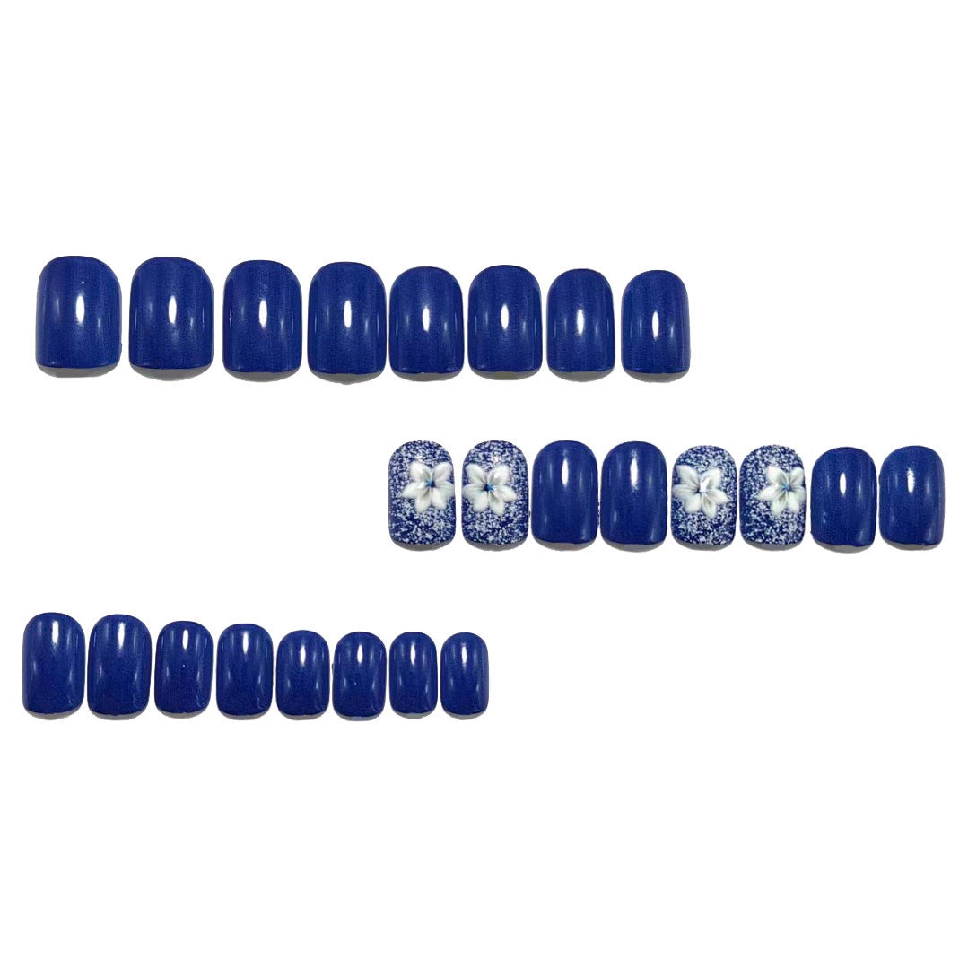 Artificial nails in elegant glitter design with floral embellishments Stornfield