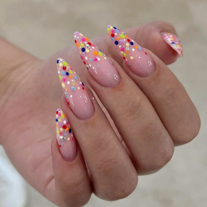 Acrylic nail set with colorful glitter dots and elegant tips Stornfield