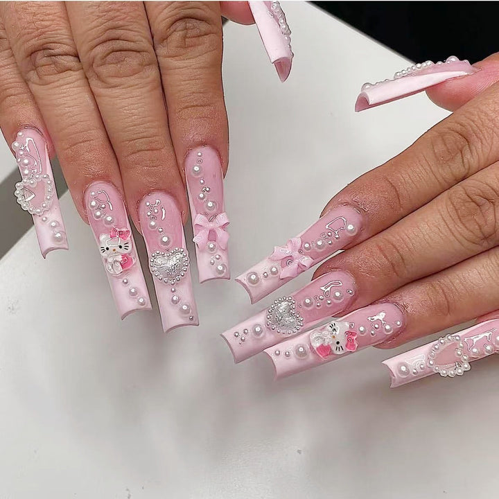 Artificial nail set with playful 3D care and pearl decorations Stornfield