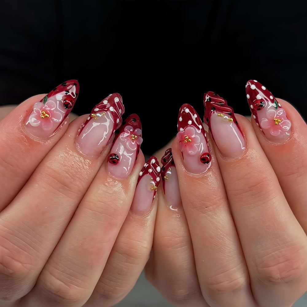 Artificial nails with floral design and 3D accents Stornfield