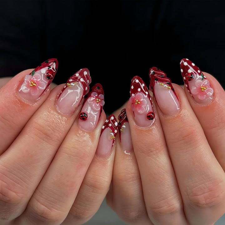 Artificial nails with floral design and 3D accents Stornfield