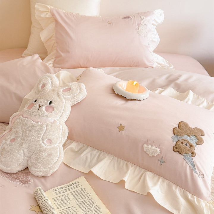 Romantic ruffle bedding set with embroidered teddy bear and cloud appliqués