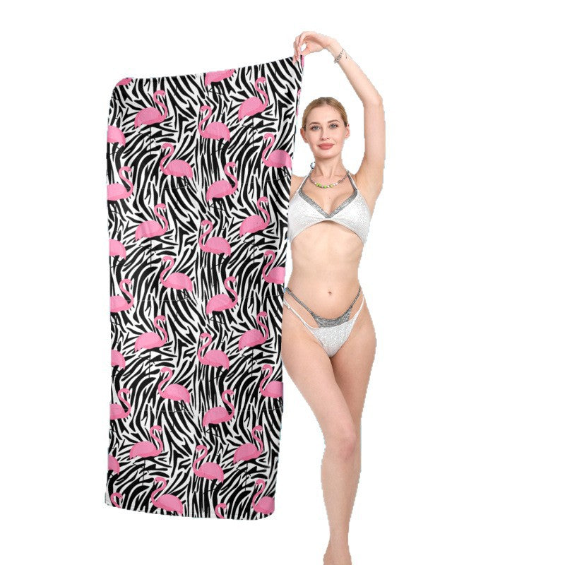 Beach towel with vibrant flamingo pattern and geometric design Stornfield