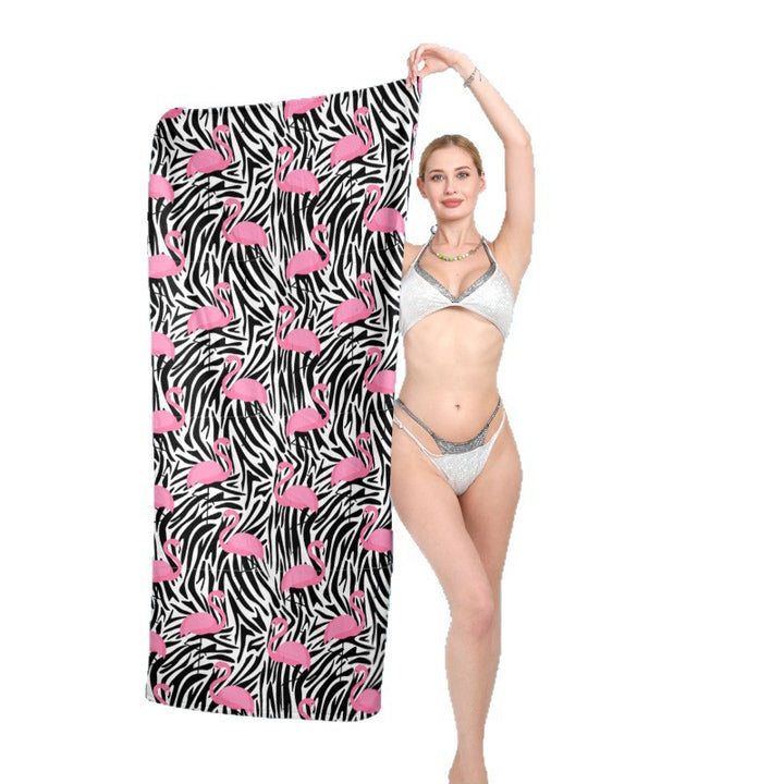 Beach towel with vibrant flamingo pattern and geometric design Stornfield