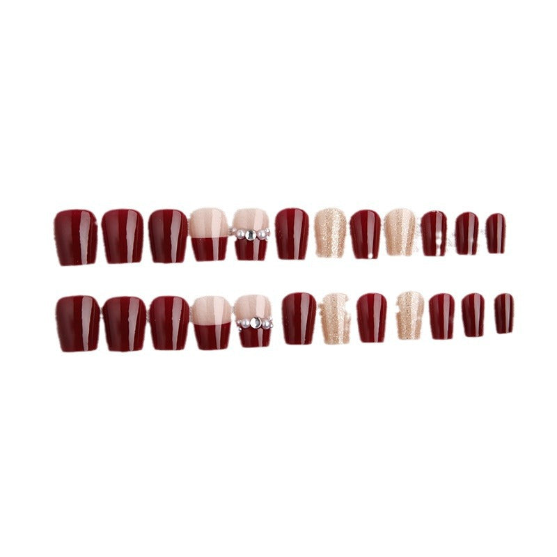 Glamorous artificial nails with glitter and pearl decorations Stornfield