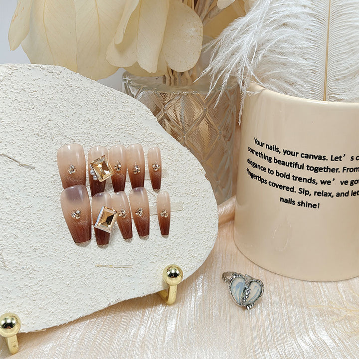 Artificial nails with elegant ombre effect and exquisite gemstones Stornfield
