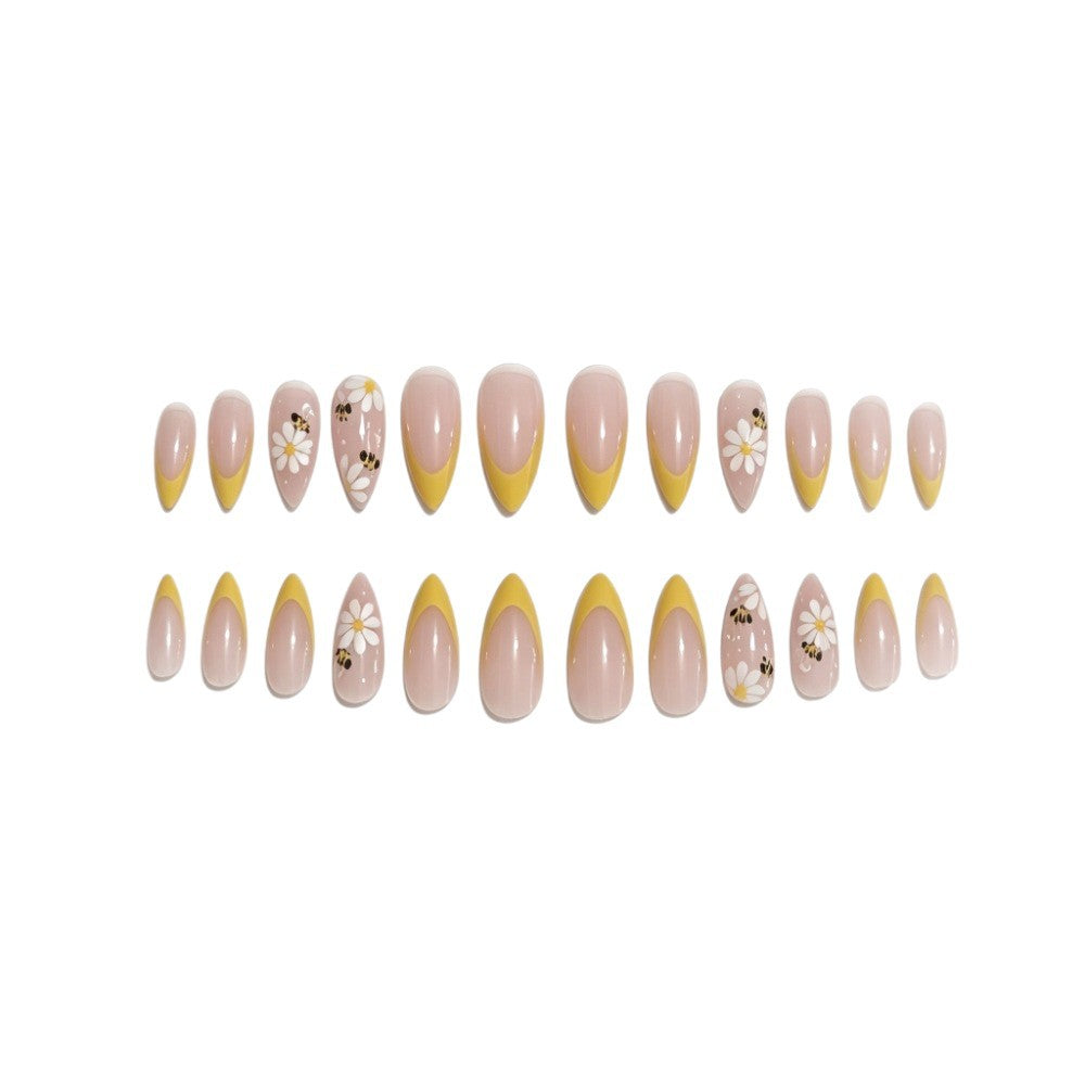 Artificial nails with elegant French tip and floral accents Stornfield