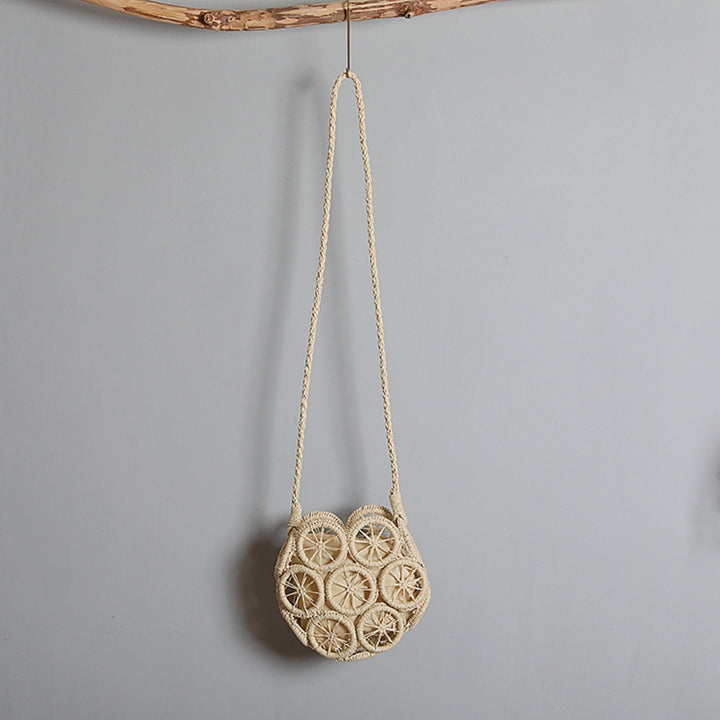 Shoulder bag made of handwoven raffia with intricate embellishments Stornfield