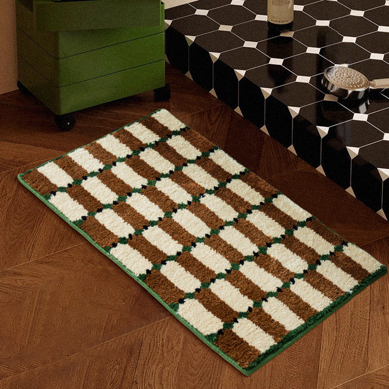 Hand-tufted bathroom mat with a velvety pile, non-slip latex backing, and geometric honeycomb check pattern Stornfield