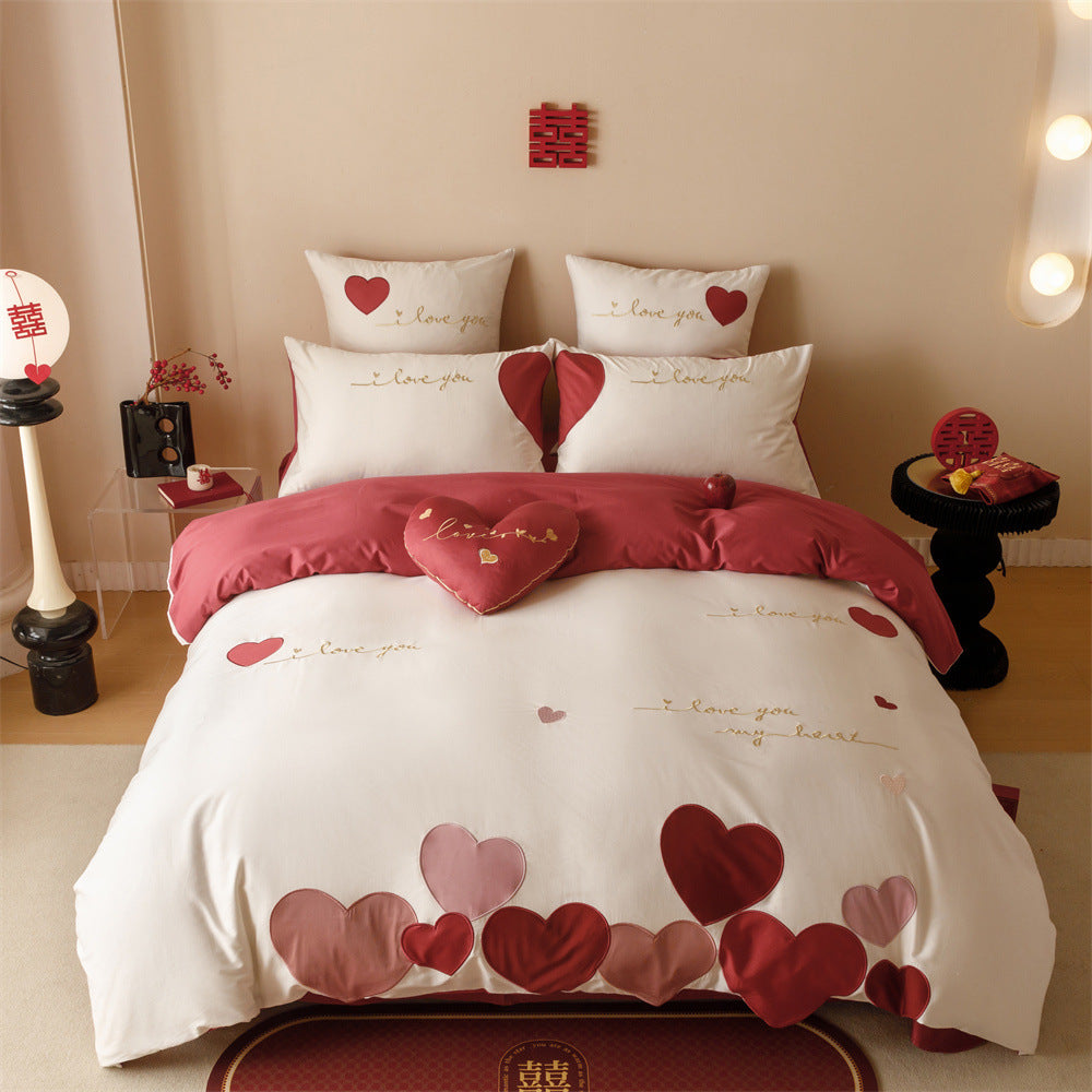 Romantic bedding set made of cotton satin with appliquéd hearts and golden embroidery