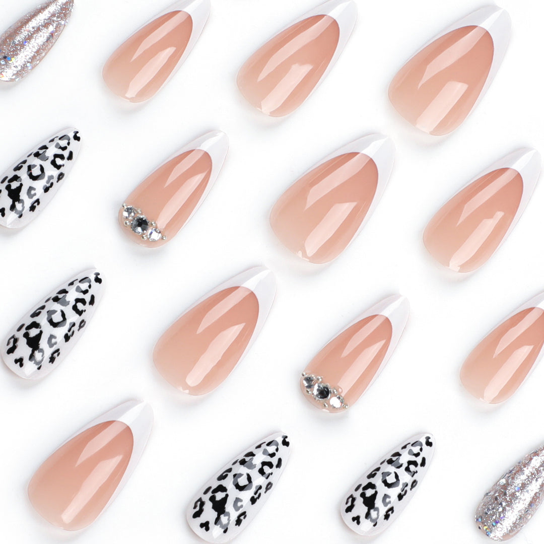 Artful stiletto nails with leopard patterns and glitter accents Stornfield