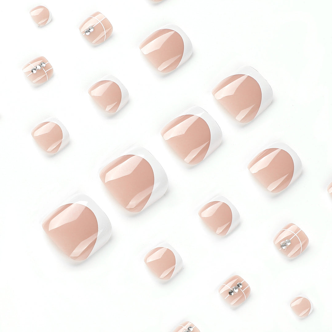 Artful toenail design with elegant style and rhinestone embellishments Stornfield
