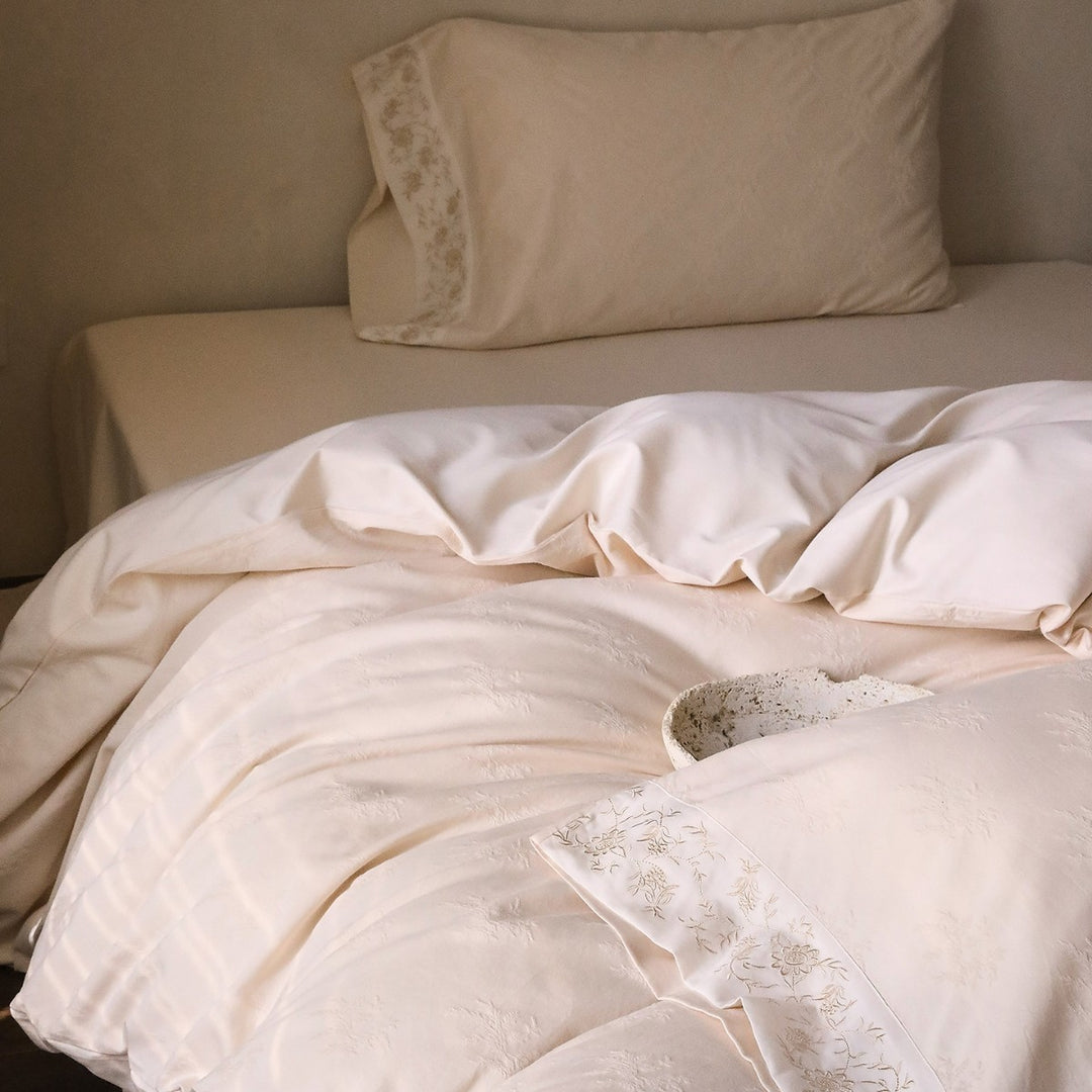 Exclusive cotton satin bedding set with tonal floral jacquard and fine decorative embroidery