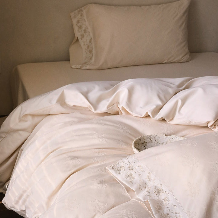 Exclusive cotton satin bedding set with tonal floral jacquard and fine decorative embroidery