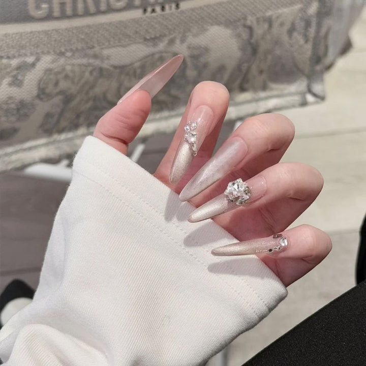 Glamorous artificial nail tips with elegant decorations Stornfield