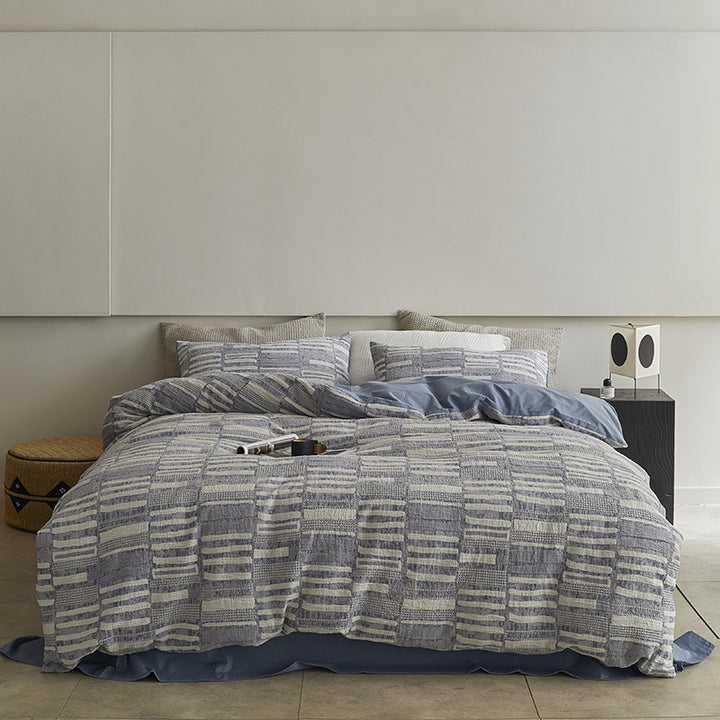 Quilted bed set with textured jacquard stripe design