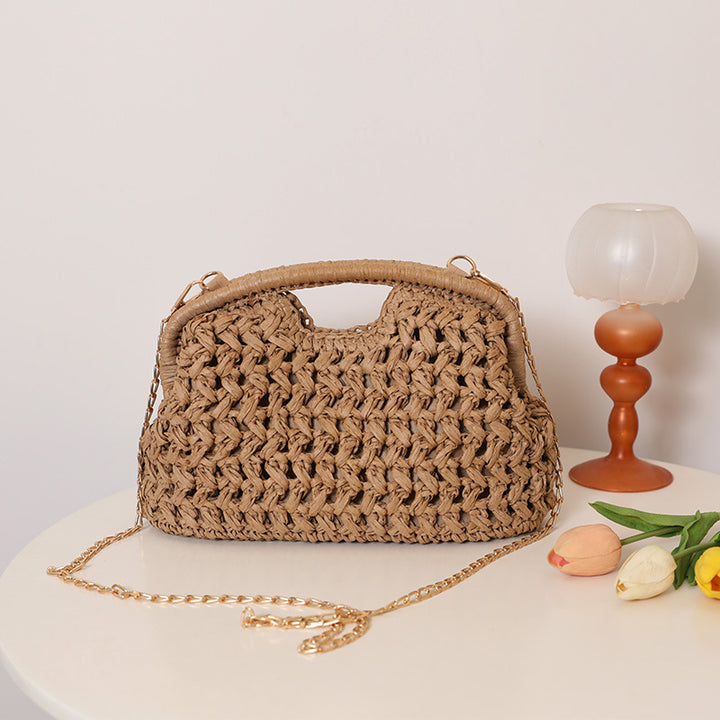 Handcrafted rattan bag with elegant handles and chain straps Stornfield