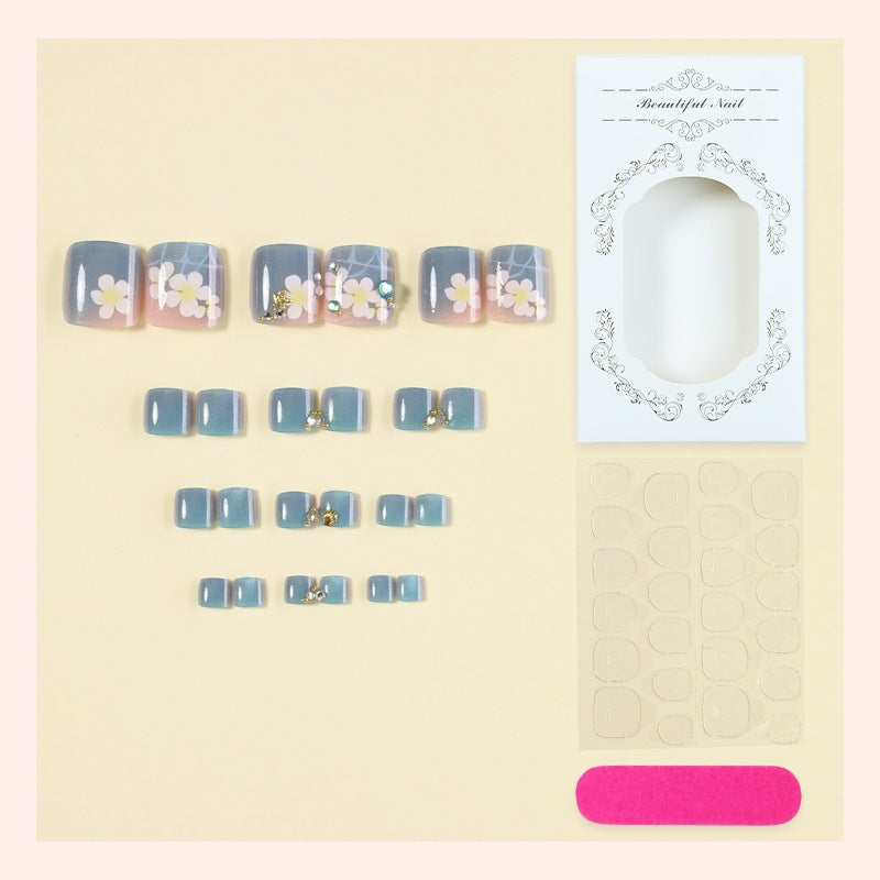 Artificial nail set with floral appliqués and glitter effects Stornfield