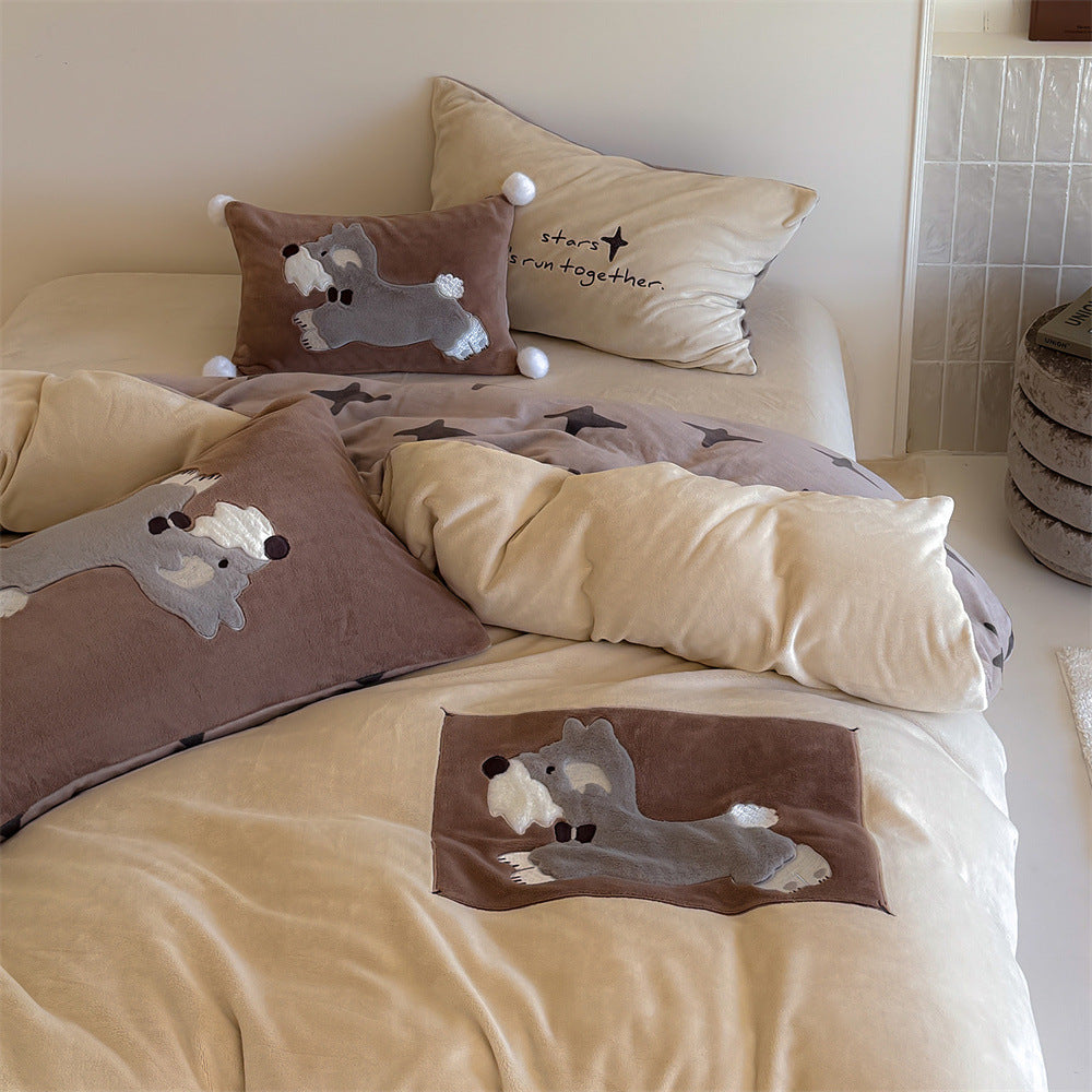 Plush bedding set with embroidered dog motif and striped cuddle blanket