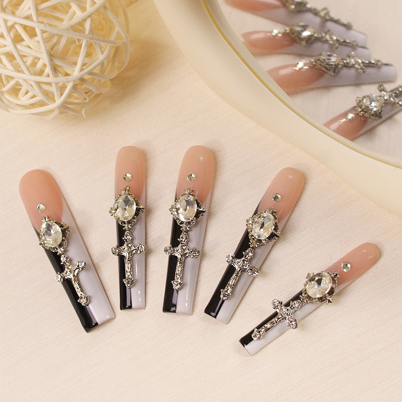 Glamorous artificial nails with elegant cross decorations Stornfield