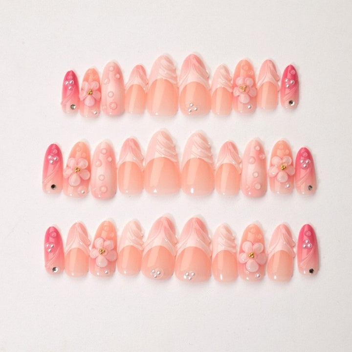 Artificial nail set with delicate floral and glitter accents Stornfield