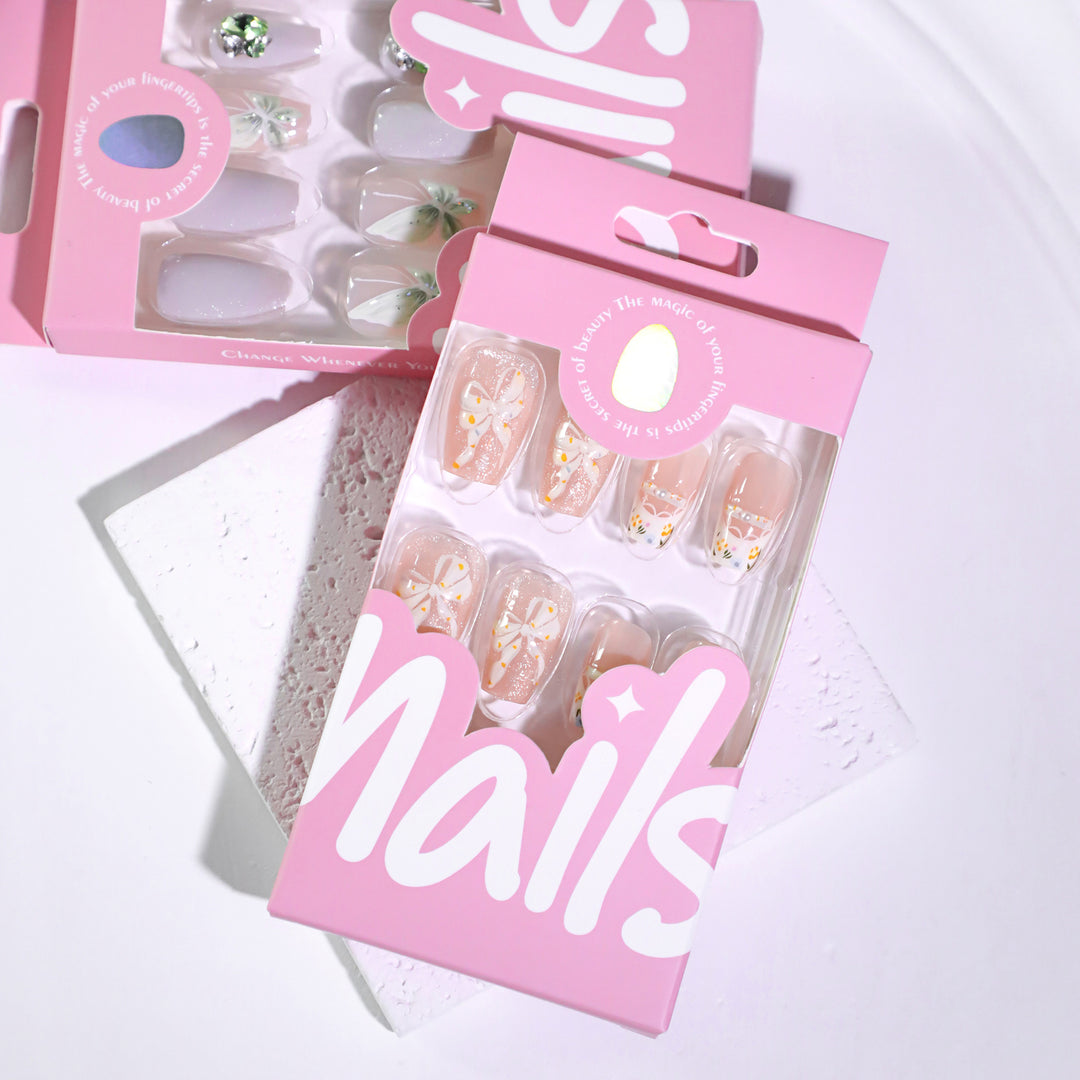 Artful Nail Extensions with Floral Design and Bow Accents Stornfield