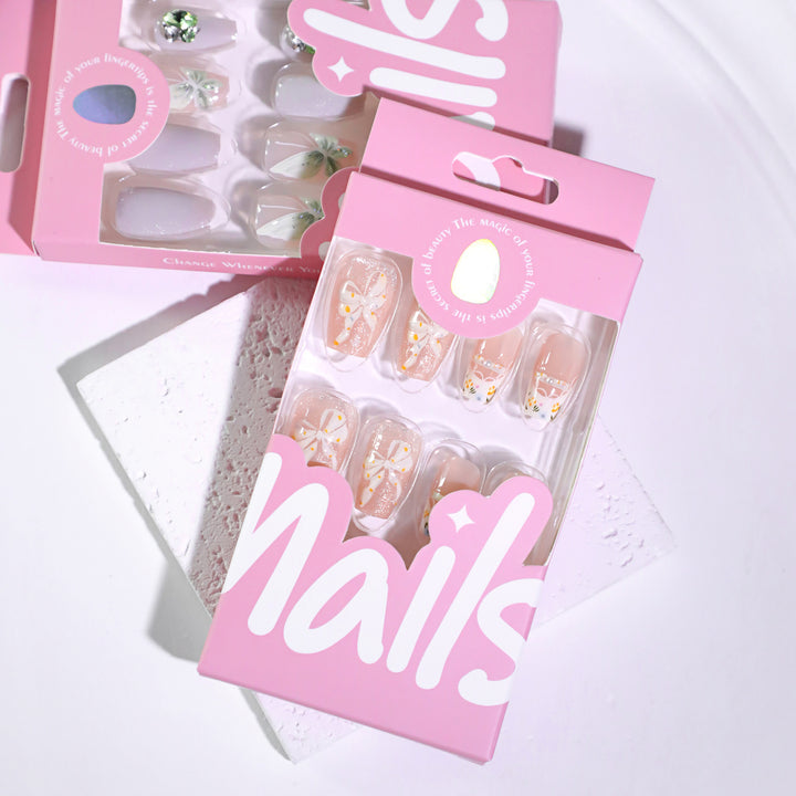 Artful Nail Extensions with Floral Design and Bow Accents Stornfield