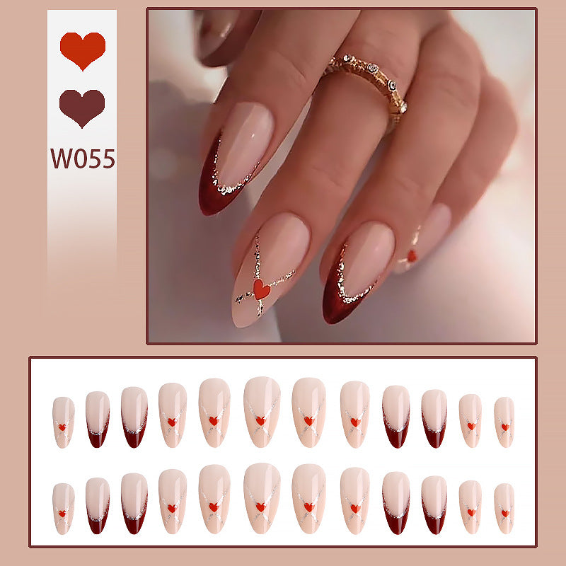 Acrylic nails with heart motifs and glitter details Stornfield