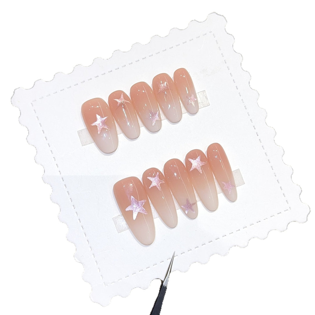 Artificial nails with sparkling stars and gentle gradient Stornfield