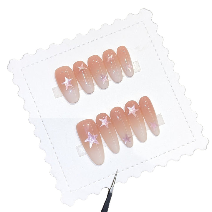 Artificial nails with sparkling stars and gentle gradient Stornfield