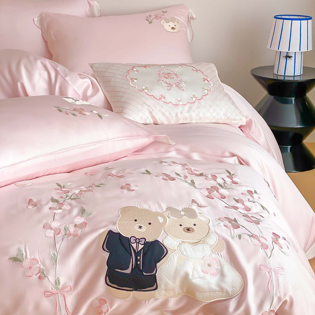Satin bedding set with embroidered wedding bears, ruffled hem & decorative pillows