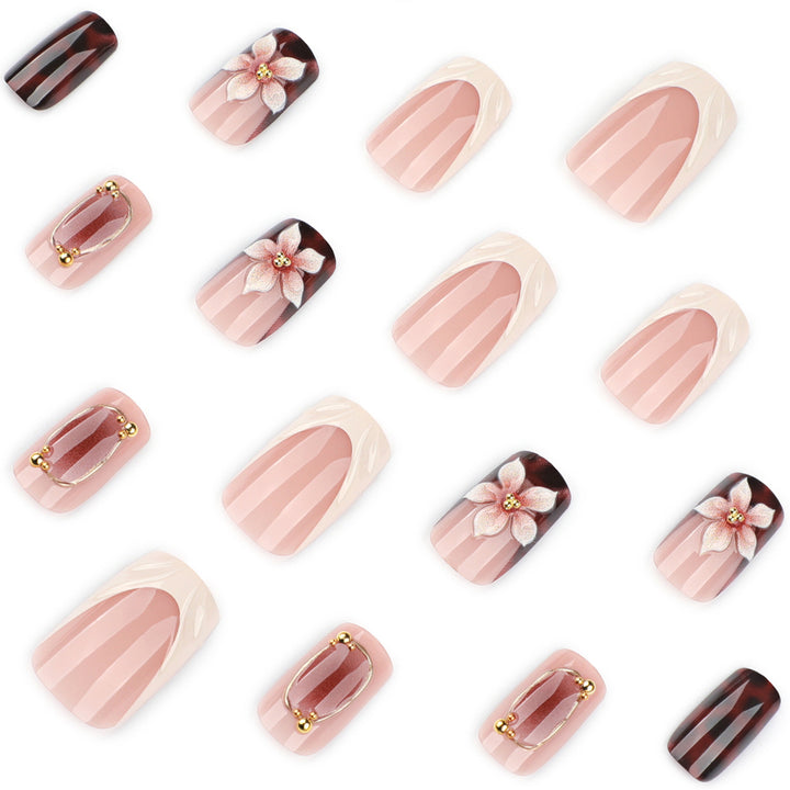 Artistic stiletto nails with elegant floral design and glitter effects Stornfield