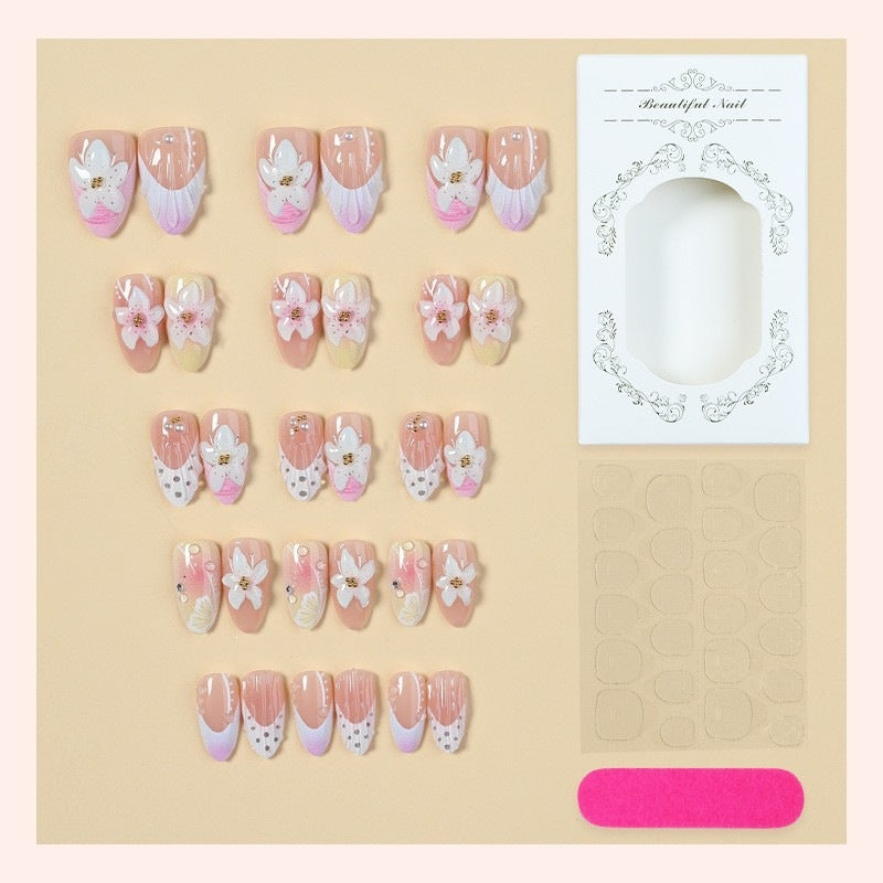 Artificial nail set with delicate floral designs and elegant accents Stornfield