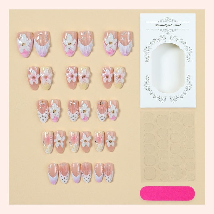 Artificial nail set with delicate floral designs and elegant accents Stornfield