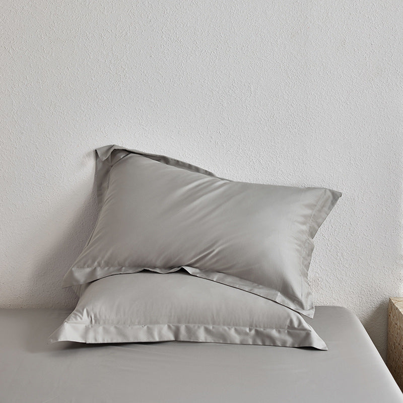 Premium pillowcase and fitted sheet set made of cotton percale with hotel edge
