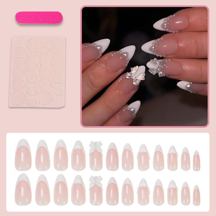 Artificial nail set with elegant tips and playful bow details Stornfield