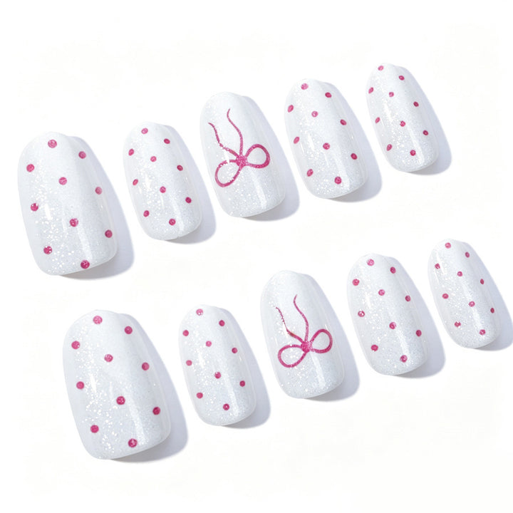 Artificial nail set with delicate dots and bow pattern Stornfield