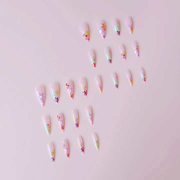Acrylic nail set with vibrant floral designs and sharp accents Stornfield