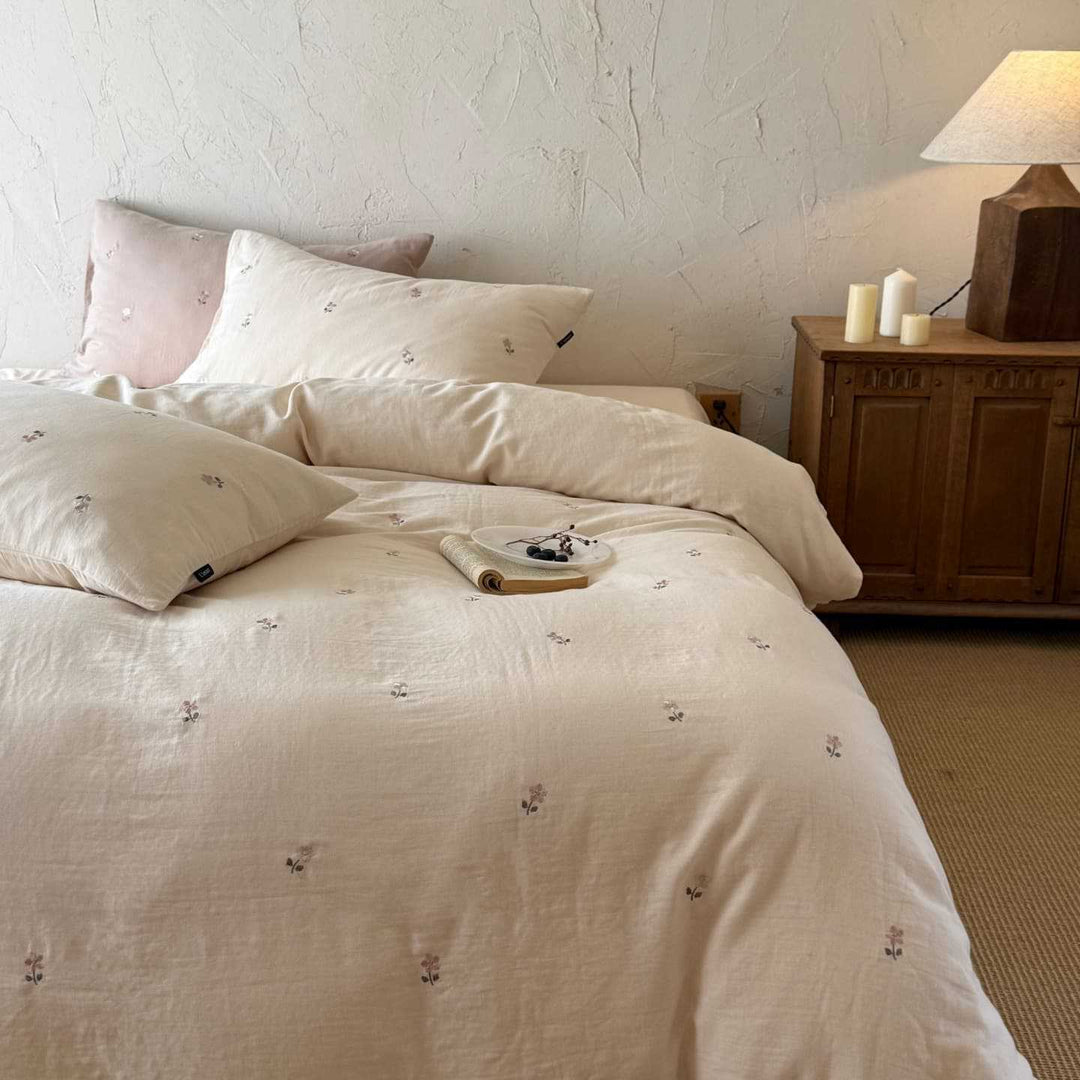 Breathable cotton bedding set with delicate flower embroidery and tie ribbon pillow
