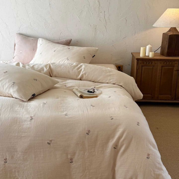 Breathable cotton bedding set with delicate flower embroidery and tie ribbon pillow