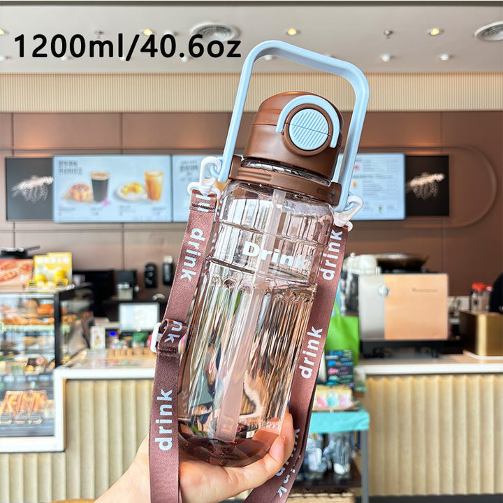 Women's large transparent drinking bottle with integrated carrying handle Stornfield
