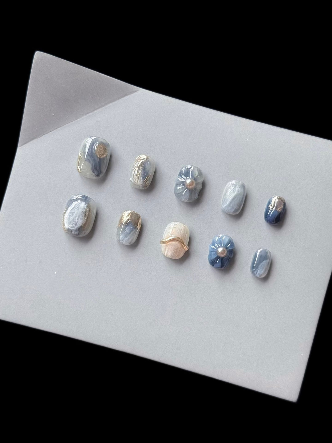 Artistic Press-On Nail Art Set with Unique Floral and Marble Accents